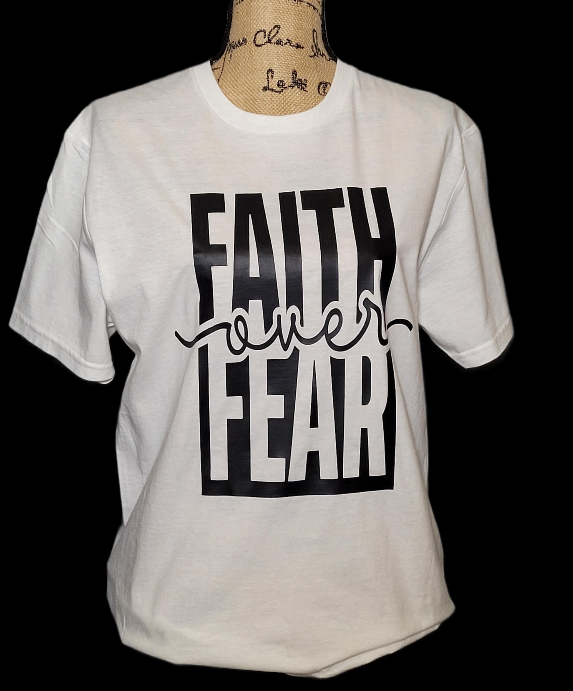 Faith Over Fear statement tee — design close-up